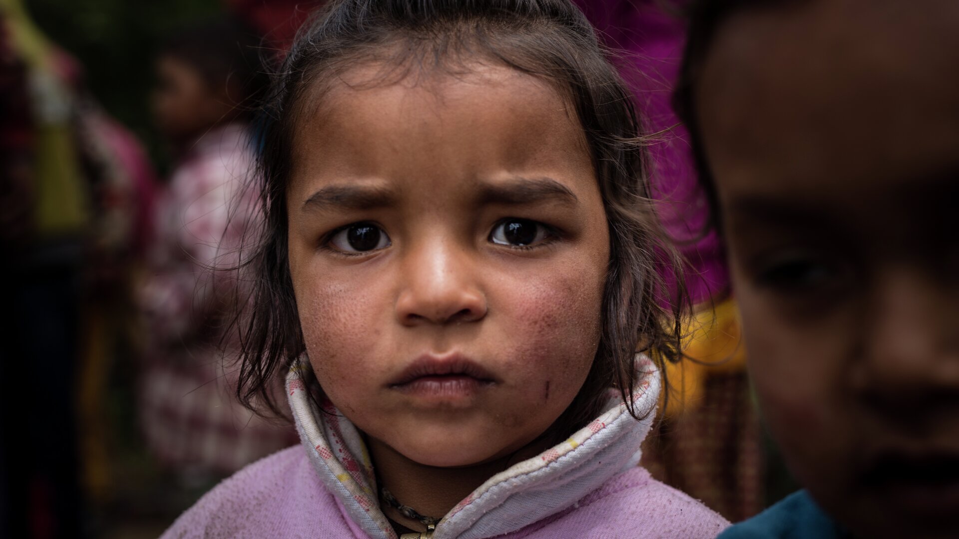 Sad girl staring at camera nepal